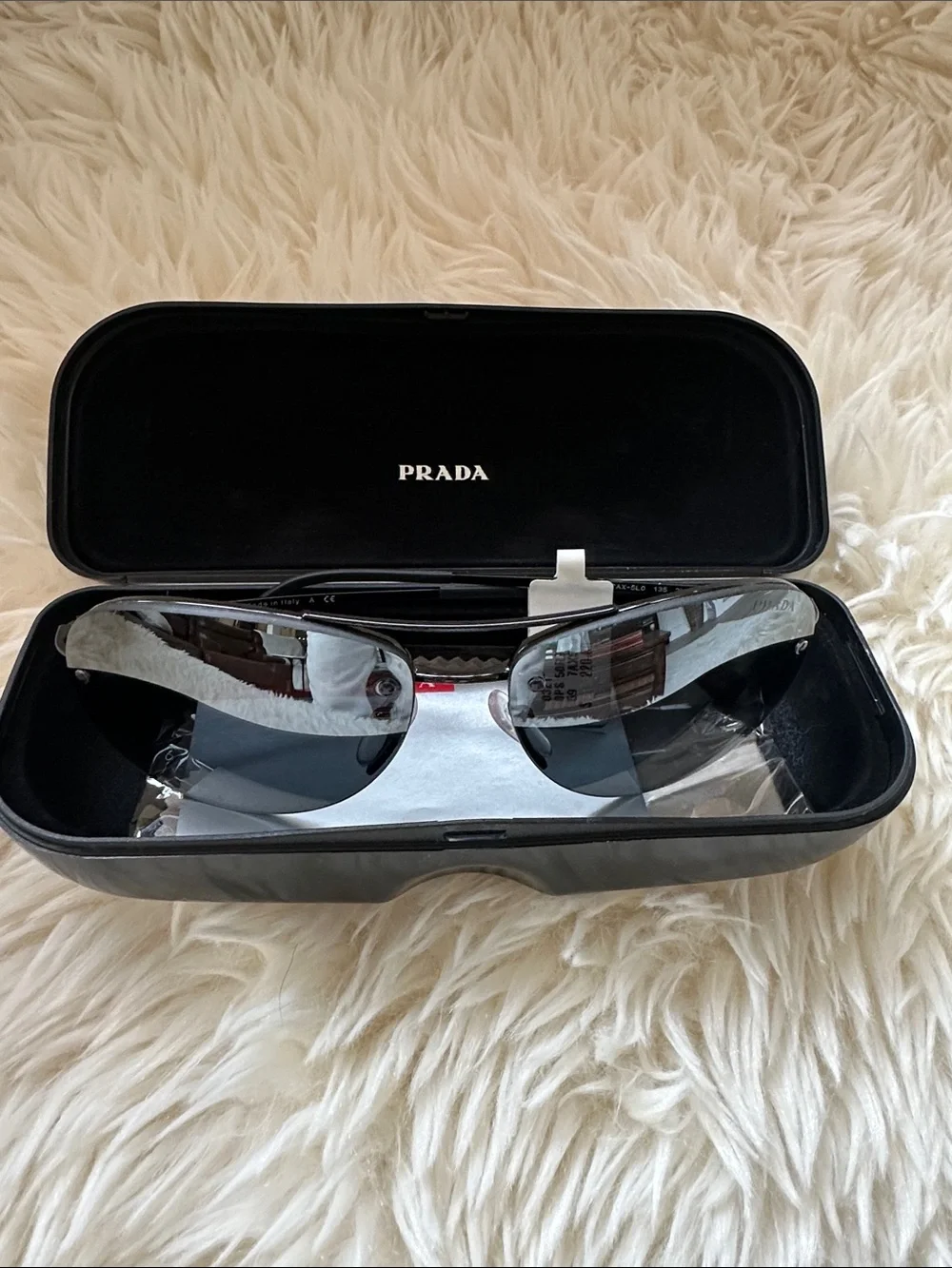 Prada Men’s Black and Silver Rimless Sunglasses